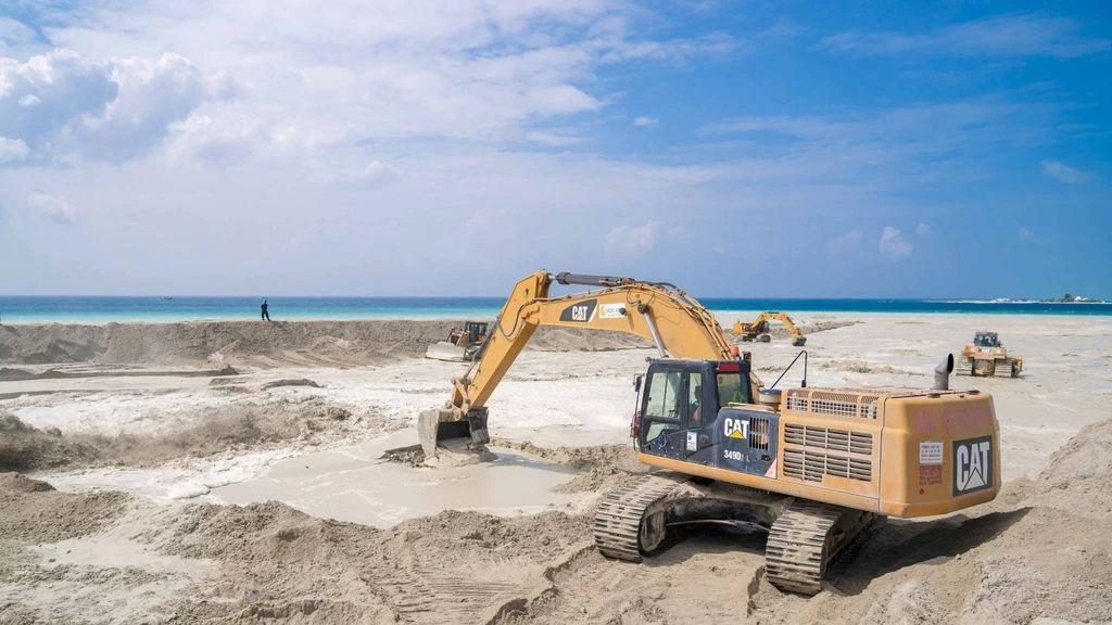 Coastal construction site near Málaga with the Mediterranean in the background.